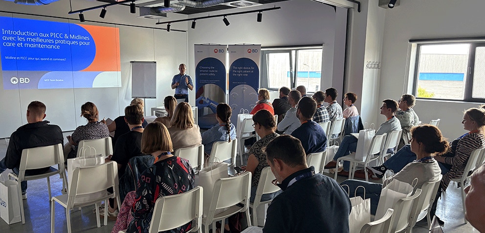 People listening to the presentation