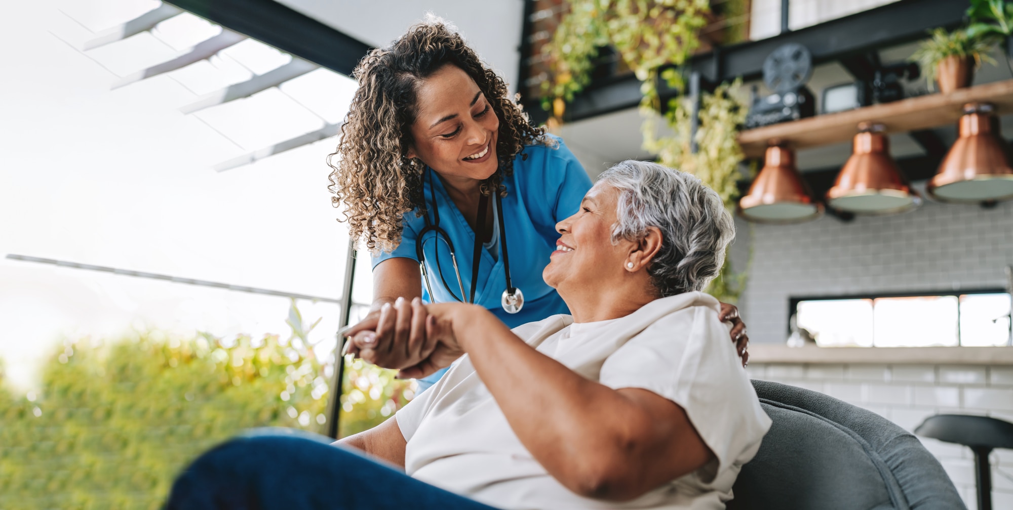 Patient in home smiling nurse 
