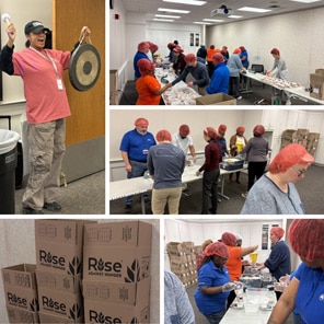 Volunteers Packing Food Boxes in Warehouse