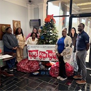 Group Toy Drive Around Christmas Tree Display
