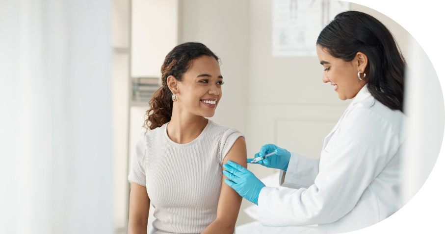 Healthcare professional administering patient vaccination shot