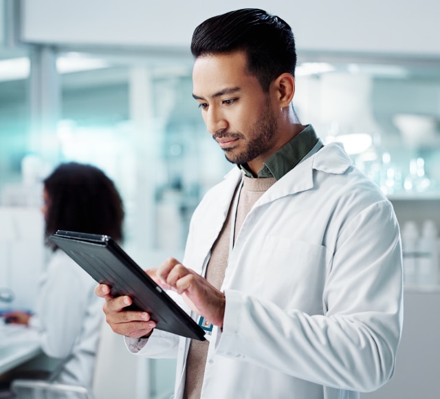 Scientist using digital tablet in laboratory