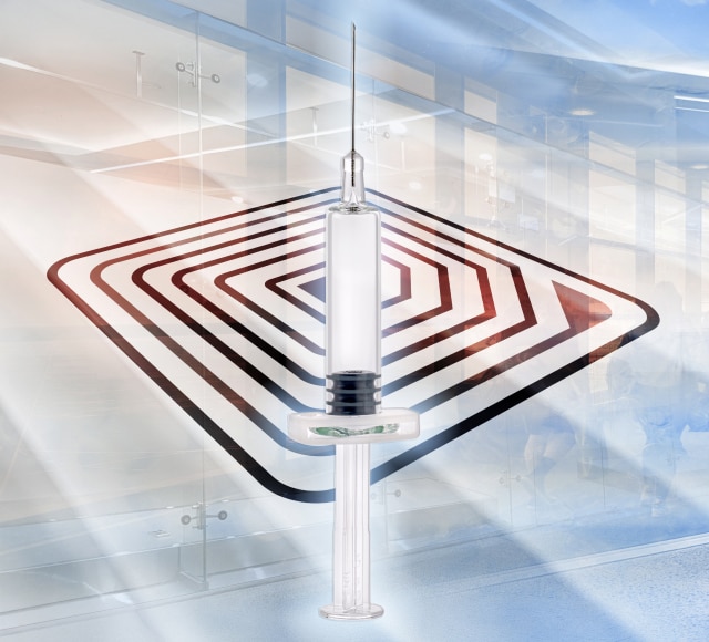 Prefillable syringe over abstract RFID pattern
