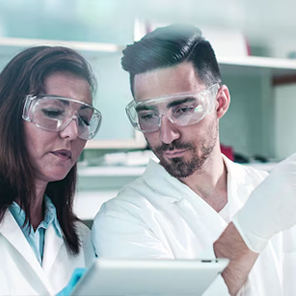 Scientists collaborating in modern laboratory setting