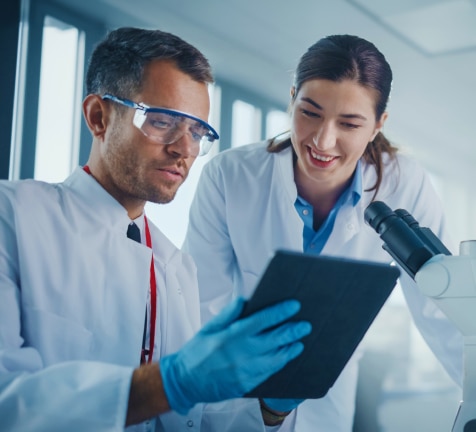 Scientists analyzing data in laboratory