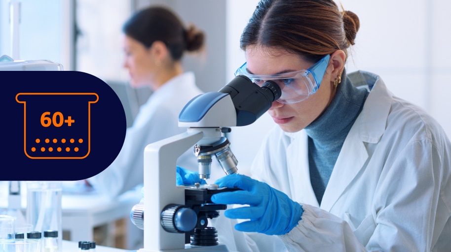 Scientist using microscope in laboratory setting