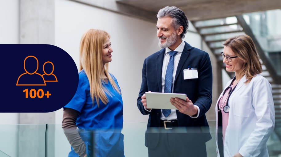 Healthcare professionals discussing with tablet