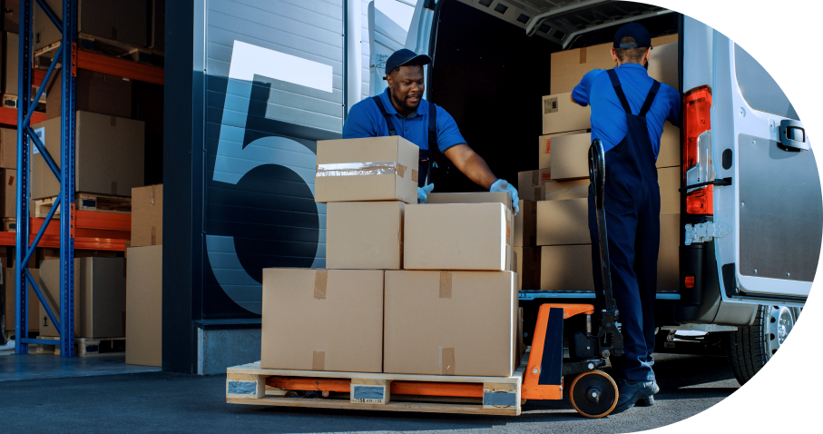 Workers loading boxes into delivery van