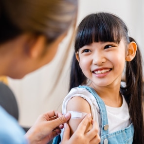 Child receiving vaccination in clinic