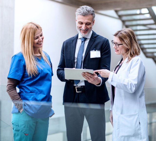 Medical professionals discussing patient information indoors