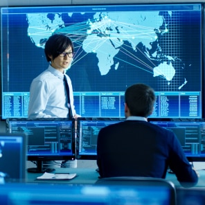 Team Analyzing Global Data in Control Room