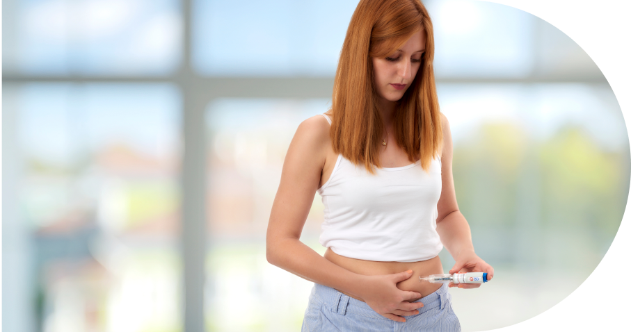 Woman self-administering injection in bright indoor setting