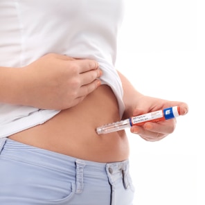 Person self-injecting medication with insulin pen device