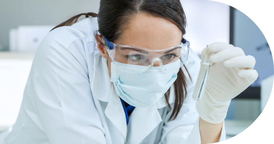 Scientist in laboratory holding test tube