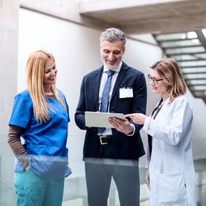 Medical professionals discussing patient information in hospital