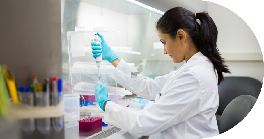 Scientist Pipetting Samples in Laboratory Hood