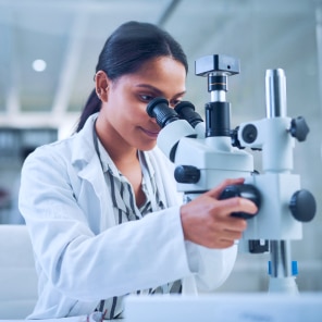 Scientist using advanced laboratory microscope equipment