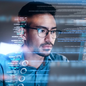 Software developer analyzing code on screen
