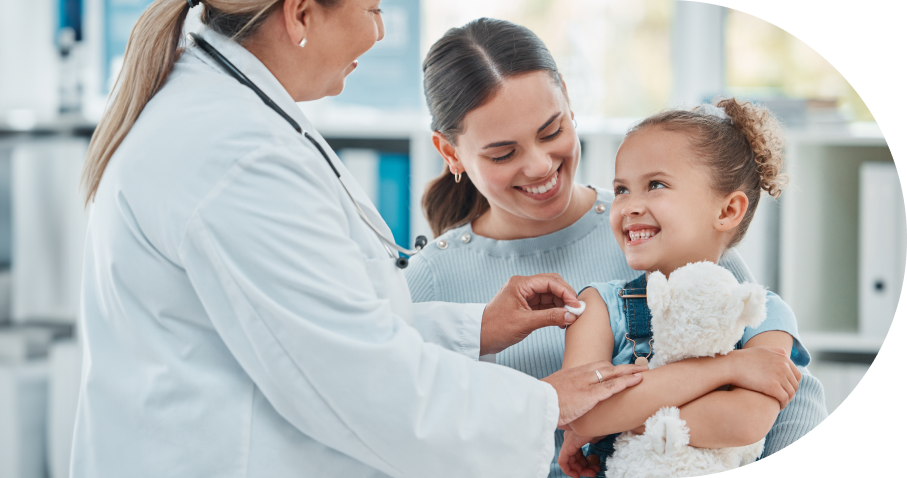 Doctor administering vaccine to young child