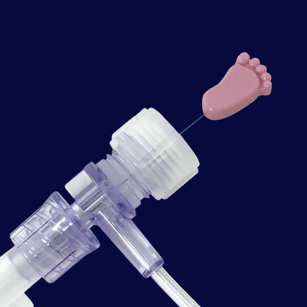 Medical connector with pink baby foot cap