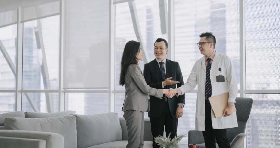 Aerial view of a canyon with grey and gold rocks with a blue river running down the middle.